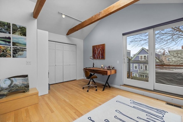 office area with lofted ceiling with beams, baseboards, visible vents, and wood finished floors