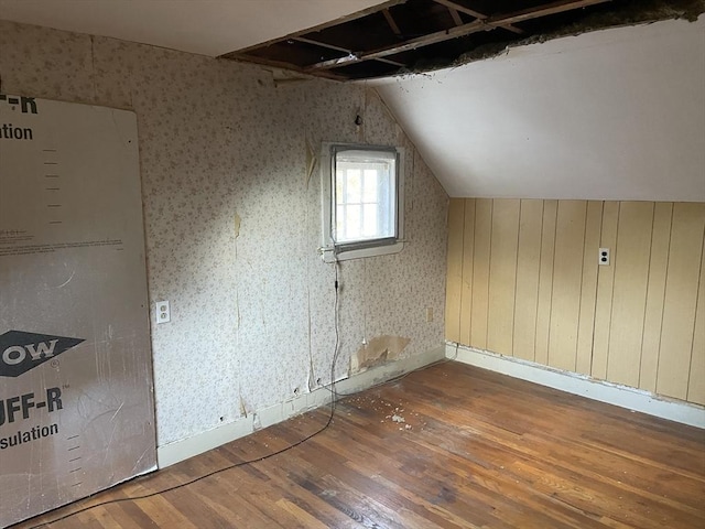 bonus room with hardwood / wood-style flooring and lofted ceiling