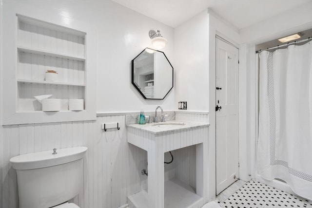 11 Congress St, Newburyport, MA 01950 - full bath with a sink, wainscoting, toilet, and a shower with shower curtain