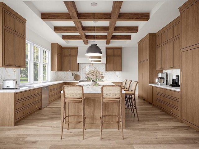 kitchen with stainless steel dishwasher, beamed ceiling, tasteful backsplash, a kitchen breakfast bar, and light countertops