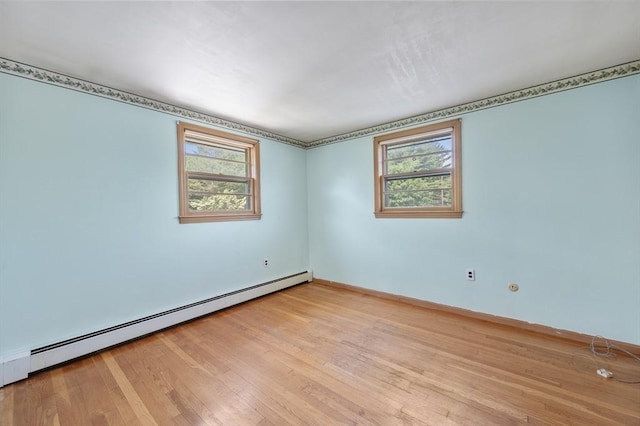 34 Buena Vista Ave, Salem, MA 01970 - unfurnished room featuring baseboard heating, plenty of natural light, and wood finished floors