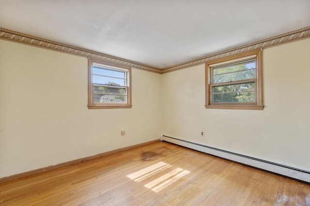 34 Buena Vista Ave, Salem, MA 01970 - spare room with a baseboard heating unit and light wood finished floors