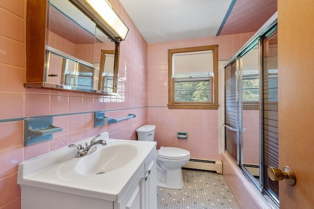 34 Buena Vista Ave, Salem, MA 01970 - full bath featuring a baseboard radiator, tile walls, vanity, tile patterned flooring, and enclosed tub / shower combo