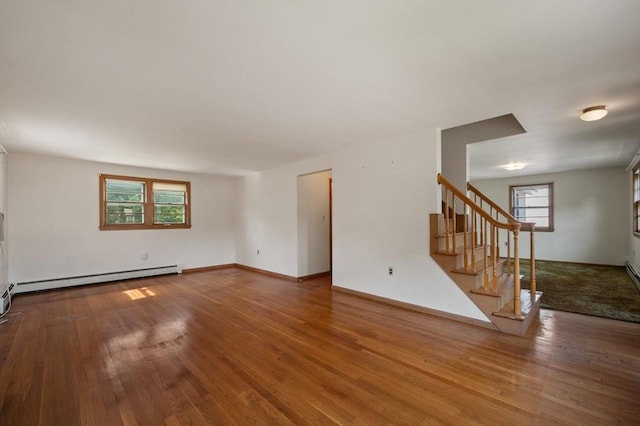 34 Buena Vista Ave, Salem, MA 01970 - unfurnished living room with stairway, baseboard heating, and wood finished floors