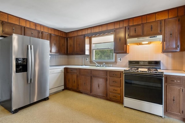 34 Buena Vista Ave, Salem, MA 01970 - kitchen with stainless steel fridge, gas stove, white dishwasher, under cabinet range hood, and light countertops