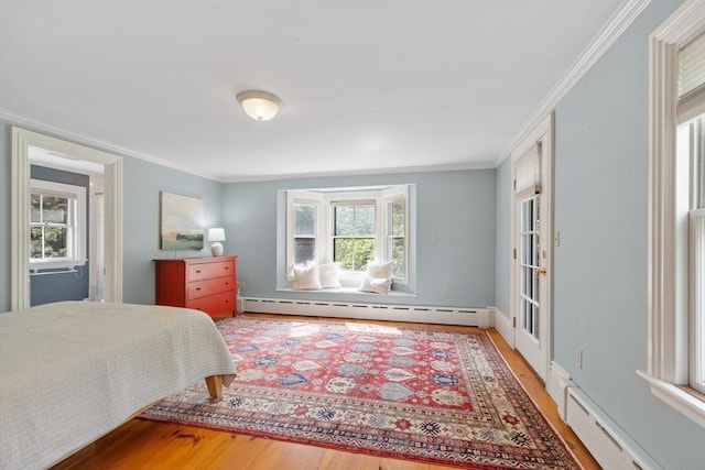 23 Centre Ave, Belmont, MA 02478 - bedroom with a baseboard heating unit, wood finished floors, and crown molding