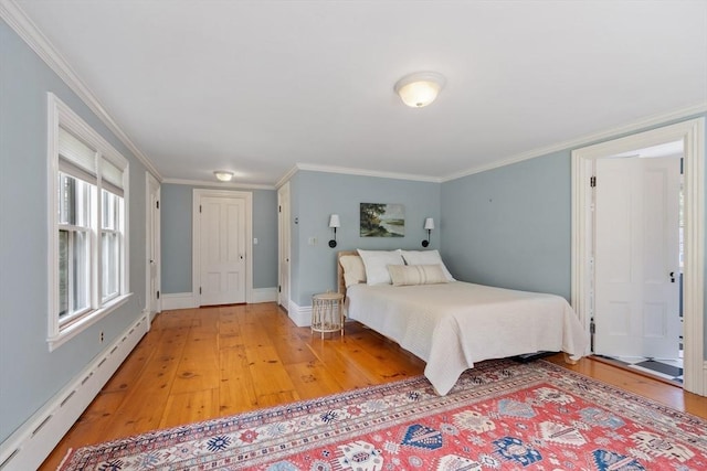23 Centre Ave, Belmont, MA 02478 - bedroom featuring a baseboard heating unit, light wood finished floors, ornamental molding, and baseboards