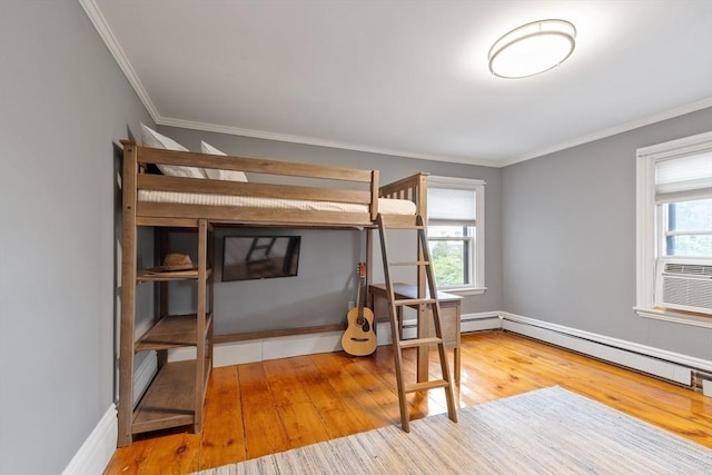 23 Centre Ave, Belmont, MA 02478 - bedroom with multiple windows, wood finished floors, crown molding, and baseboards