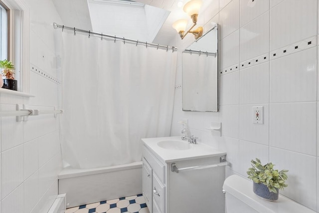 23 Centre Ave, Belmont, MA 02478 - full bathroom featuring tile walls, vanity, shower / bath combo, tile patterned floors, and toilet