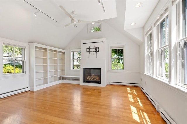 23 Centre Ave, Belmont, MA 02478 - unfurnished living room with a baseboard heating unit, a baseboard radiator, plenty of natural light, vaulted ceiling, and recessed lighting