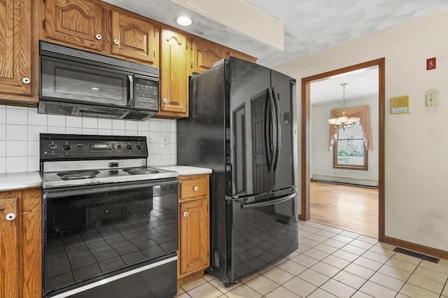 3 Westview Ter, Woburn, MA 01801 - kitchen featuring black appliances, a chandelier, backsplash, light countertops, and brown cabinetry