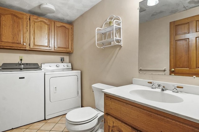 3 Westview Ter, Woburn, MA 01801 - bathroom featuring washing machine and dryer, toilet, vanity, and tile patterned floors
