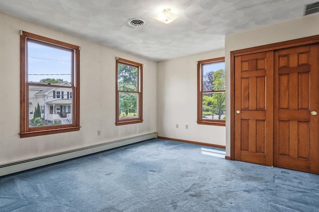 3 Westview Ter, Woburn, MA 01801 - empty room with baseboard heating, carpet, and baseboards