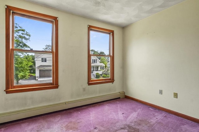 3 Westview Ter, Woburn, MA 01801 - carpeted spare room featuring a baseboard heating unit and baseboards
