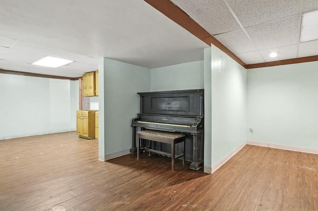 3 Westview Ter, Woburn, MA 01801 - basement with wood finished floors, a paneled ceiling, baseboards, and recessed lighting