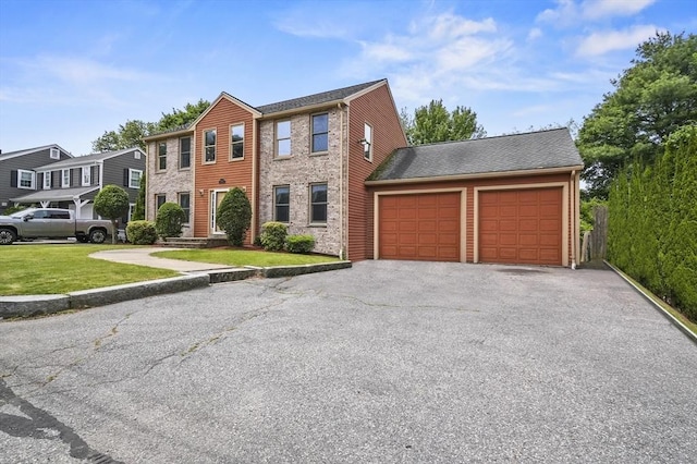 3 Westview Ter, Woburn, MA 01801 - view of front of home with a garage, asphalt driveway, and a front lawn