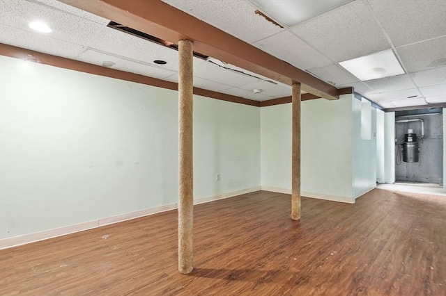 3 Westview Ter, Woburn, MA 01801 - finished below grade area with a paneled ceiling, wood finished floors, baseboards, and a central vacuum unit