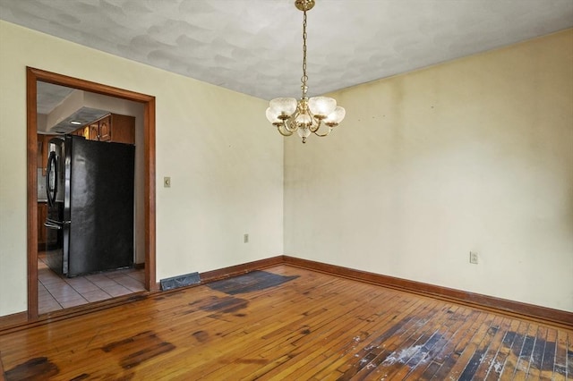 3 Westview Ter, Woburn, MA 01801 - unfurnished room with light wood-type flooring, a chandelier, and baseboards