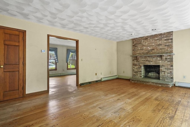 3 Westview Ter, Woburn, MA 01801 - unfurnished living room featuring baseboard heating, hardwood / wood-style flooring, baseboards, and a fireplace