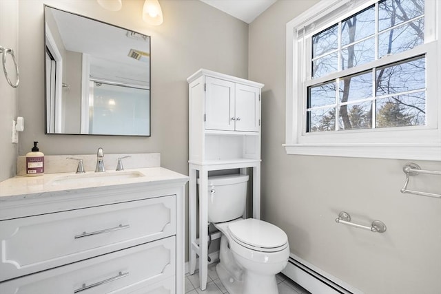 bathroom featuring toilet, baseboard heating, and vanity