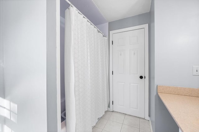 full bathroom with tile patterned flooring