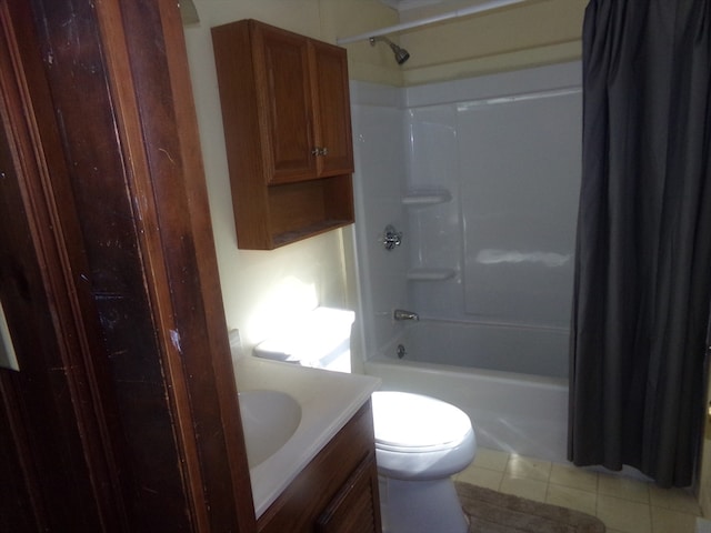 full bathroom with vanity, toilet, tile patterned floors, and shower / bath combo