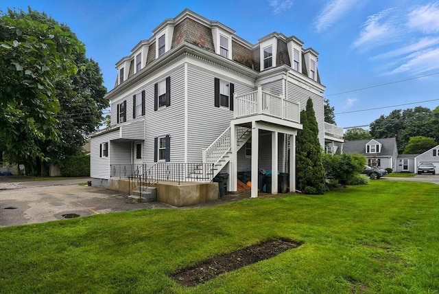 38 Moseley Ave Unit 5, Newburyport, MA 01950 - rear view of property with mansard roof and a lawn