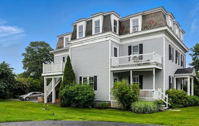 38 Moseley Ave Unit 5, Newburyport, MA 01950 - view of side of property featuring mansard roof, a balcony, a yard, and a porch