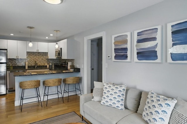 38 Moseley Ave Unit 5, Newburyport, MA 01950 - living room with wood finished floors and recessed lighting