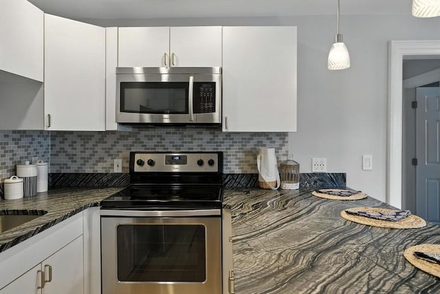38 Moseley Ave Unit 5, Newburyport, MA 01950 - kitchen with appliances with stainless steel finishes, white cabinetry, decorative backsplash, and decorative light fixtures