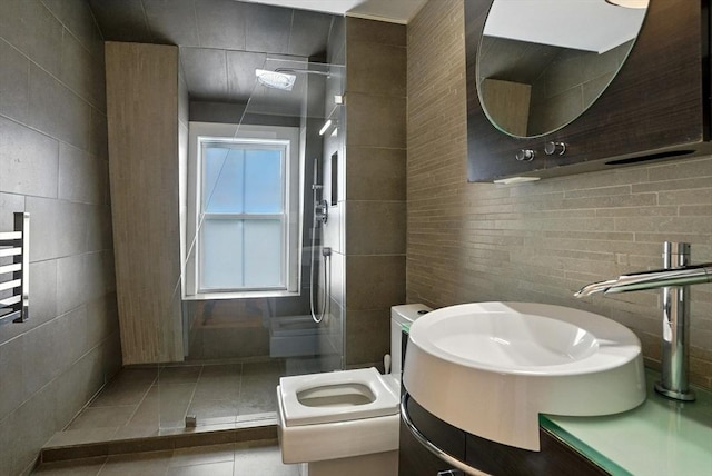 38 Moseley Ave Unit 5, Newburyport, MA 01950 - bathroom with tile walls, tiled shower, vanity, and tile patterned floors