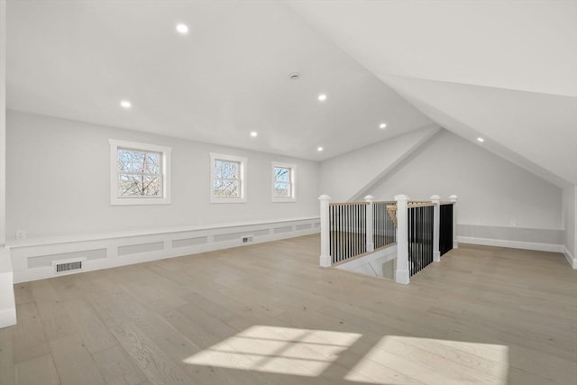 bonus room with wood finished floors, visible vents, recessed lighting, and vaulted ceiling