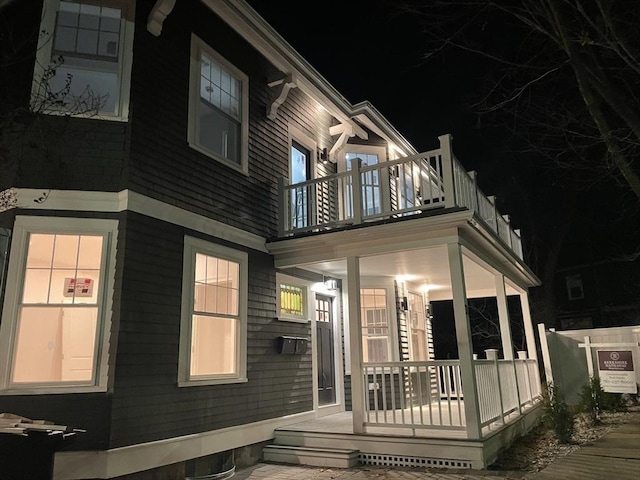 view of front of house featuring a balcony