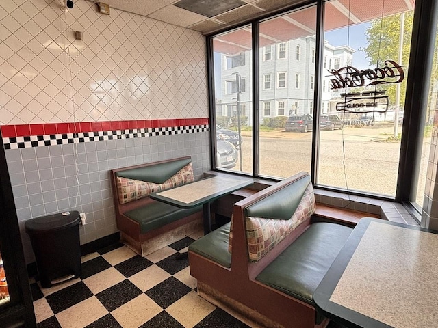 common area with tile walls