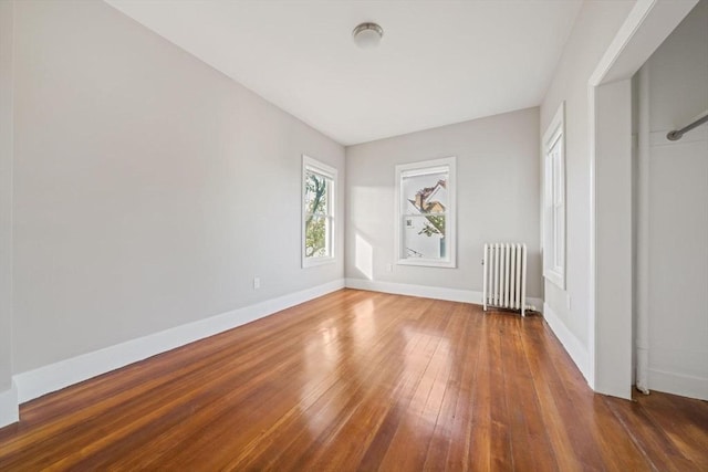 17 Magnolia Sq, Boston, MA 02125 - unfurnished room with radiator, hardwood / wood-style flooring, and baseboards