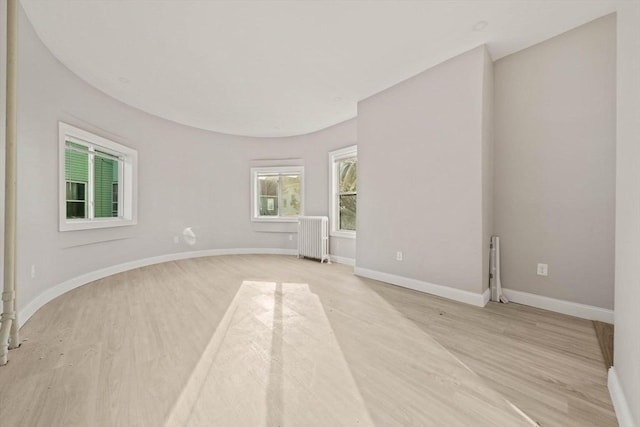 17 Magnolia Sq, Boston, MA 02125 - unfurnished room featuring radiator heating unit, light wood-type flooring, and baseboards
