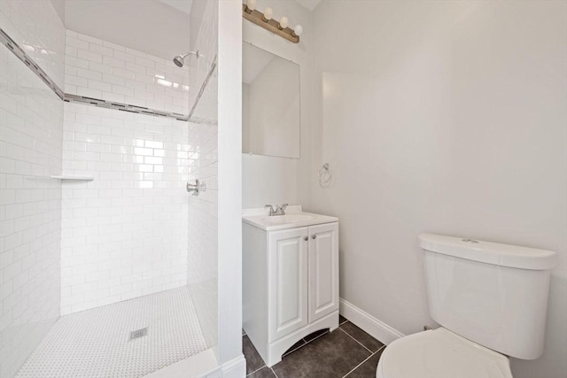 17 Magnolia Sq, Boston, MA 02125 - full bathroom with toilet, vanity, a tile shower, tile patterned flooring, and baseboards