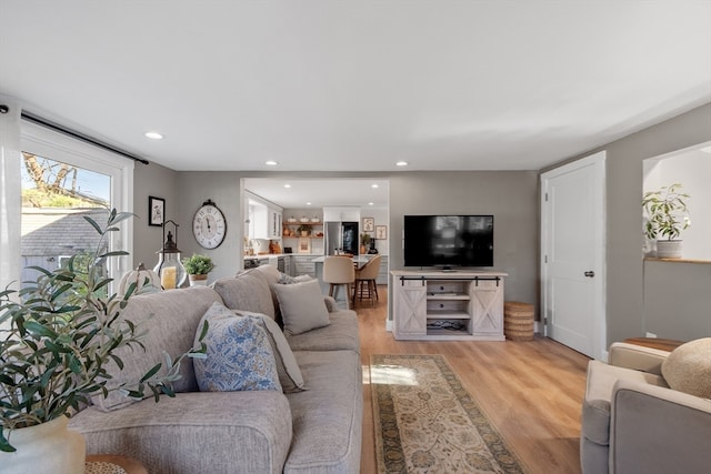 living room with light hardwood / wood-style floors