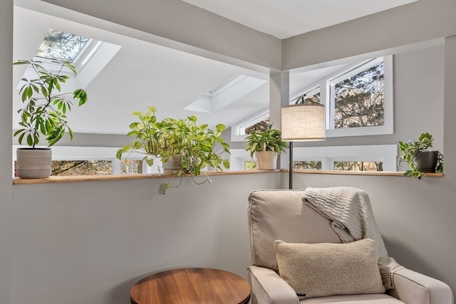 sitting room with vaulted ceiling