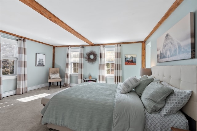 bedroom featuring beam ceiling, light colored carpet, a baseboard radiator, and ornamental molding