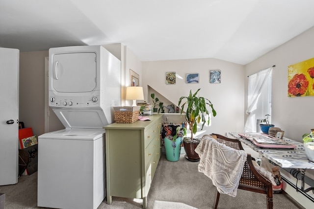 washroom featuring carpet floors and stacked washer / drying machine