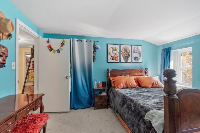 carpeted bedroom featuring vaulted ceiling