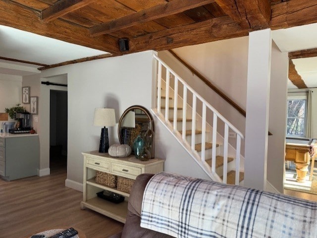 bedroom featuring hardwood / wood-style floors, wooden ceiling, and beam ceiling