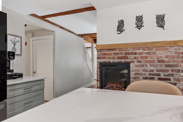 bedroom with a fireplace and brick wall