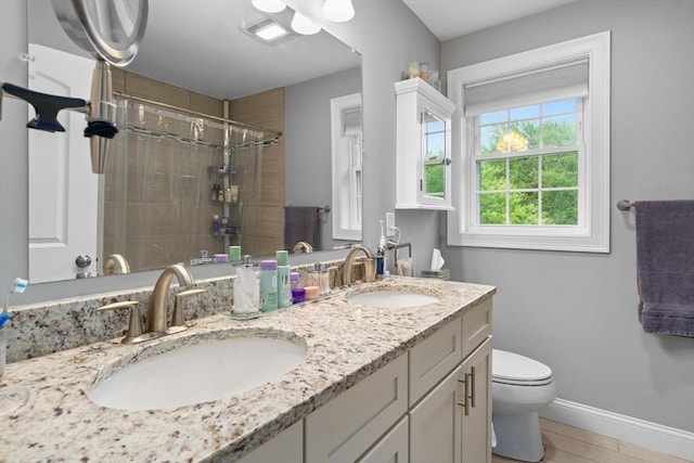 2 Heron Way Unit B, Salisbury, MA 01952 - full bathroom with tiled shower, double vanity, and wood finished floors