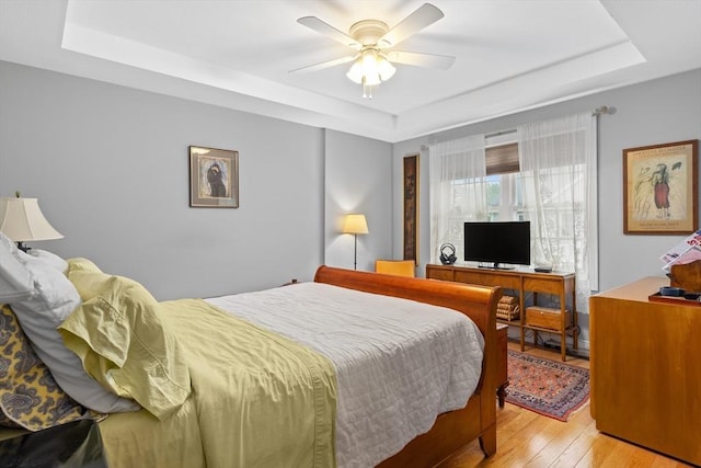 2 Heron Way Unit B, Salisbury, MA 01952 - bedroom with a tray ceiling, light wood-style floors, and ceiling fan