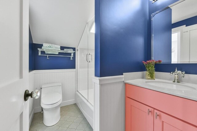 440 Cambridge St Unit 2, Cambridge, MA 02141 - bathroom featuring toilet, a wainscoted wall, vanity, and combined bath / shower with glass door
