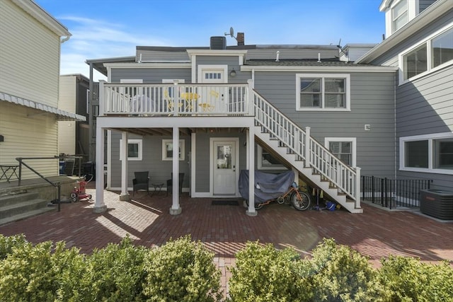 440 Cambridge St Unit 2, Cambridge, MA 02141 - back of property featuring stairs, central AC unit, a patio area, a chimney, and a deck