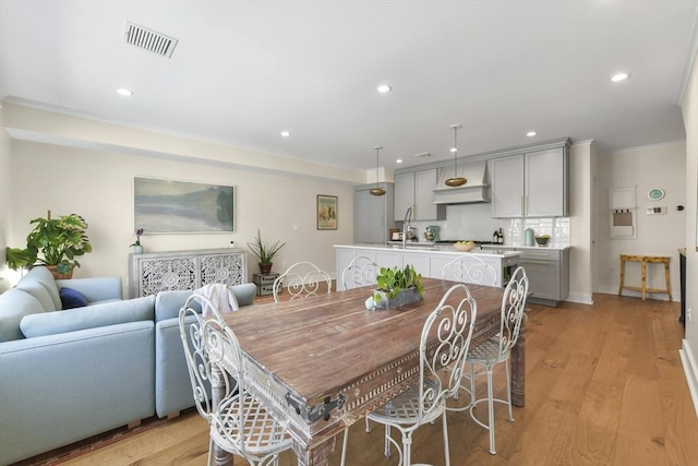 440 Cambridge St Unit 2, Cambridge, MA 02141 - dining space featuring ornamental molding, recessed lighting, and light wood finished floors