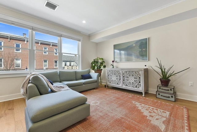 440 Cambridge St Unit 2, Cambridge, MA 02141 - living area with baseboards, wood finished floors, ornamental molding, and recessed lighting